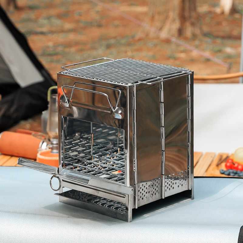 Outdoor Camping Wood Stove - เตาบาร์บีคิวสแตนเลสแบบพับได้ น้ำหนักเบา พกพาสะดวก ใช้ถ่านหรือฟืน เหมาะสำหรับตั้งแคมป์กลางแจ้ง ขนาดเล็ก